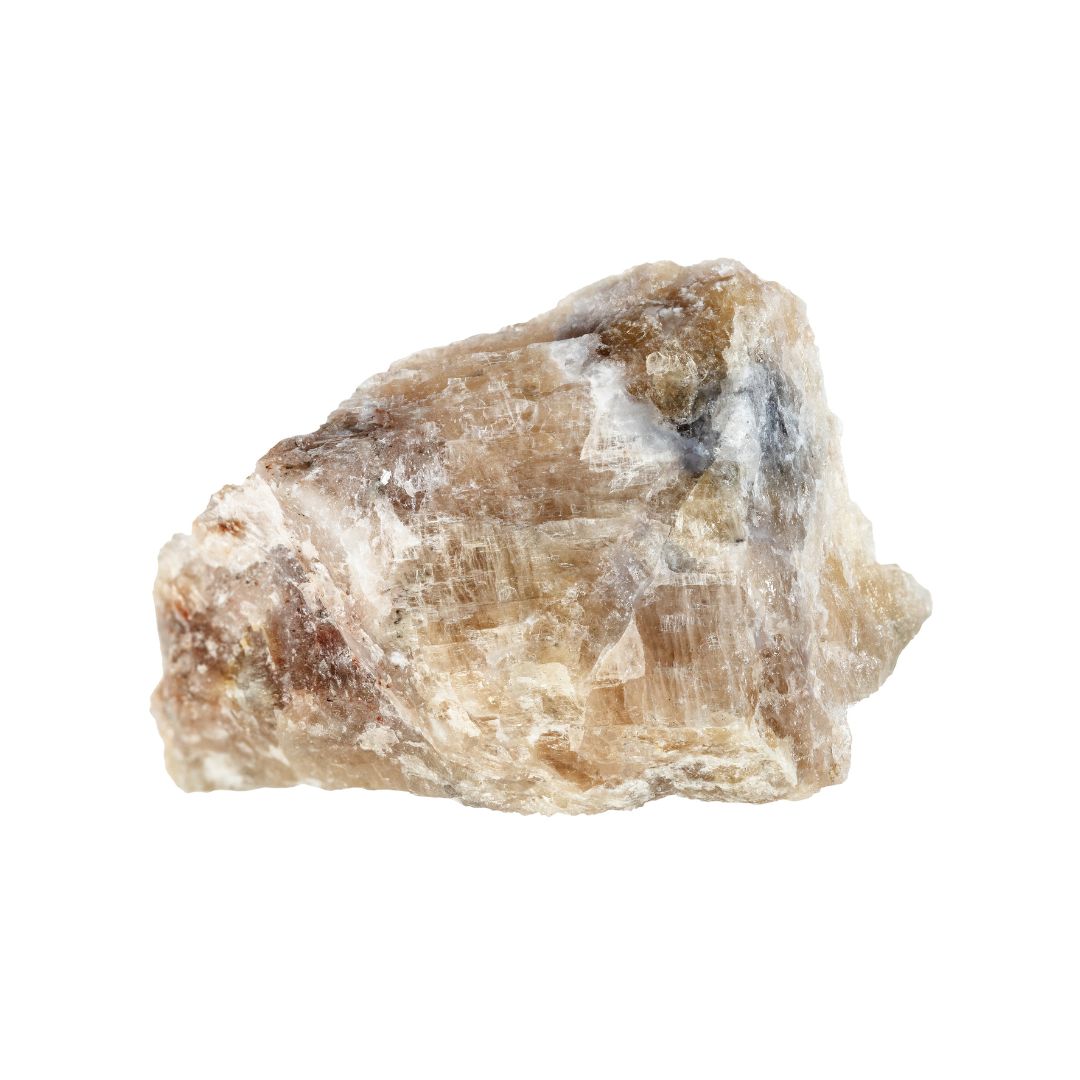 Cancrinite. A yellow/beige stone on a white background.