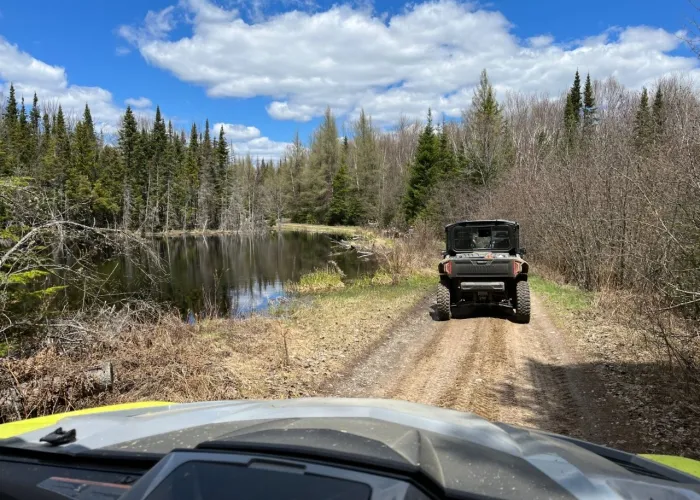 Photo of guided UTV machine on a trail during a sunny day