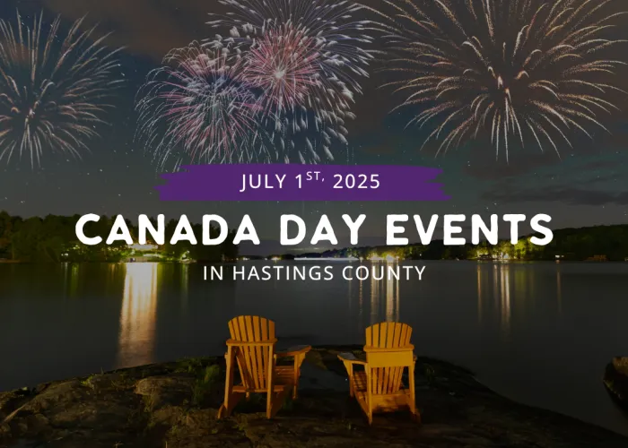 Wooden chairs overlooking lake with fireworks in background. Text Canada Day Events in Hastings County overlayed