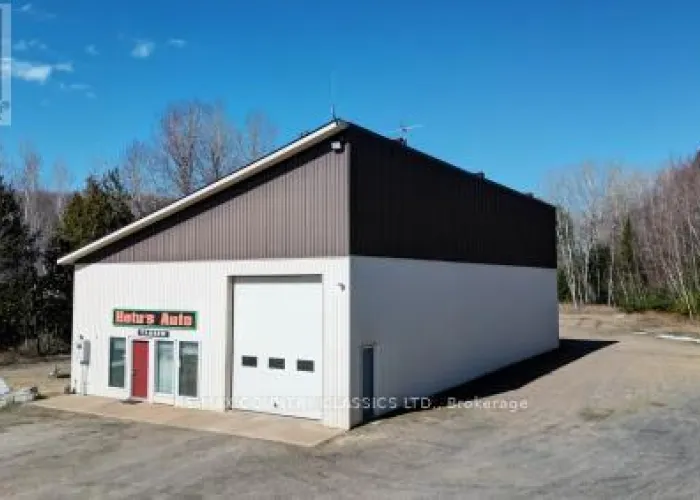 View of the front facade of a vacant commercial building on Highway 28 near Bancroft