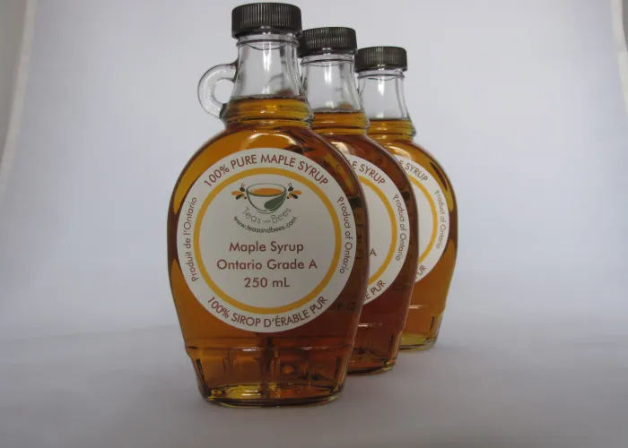 picture of bottles of maple syrup lined up